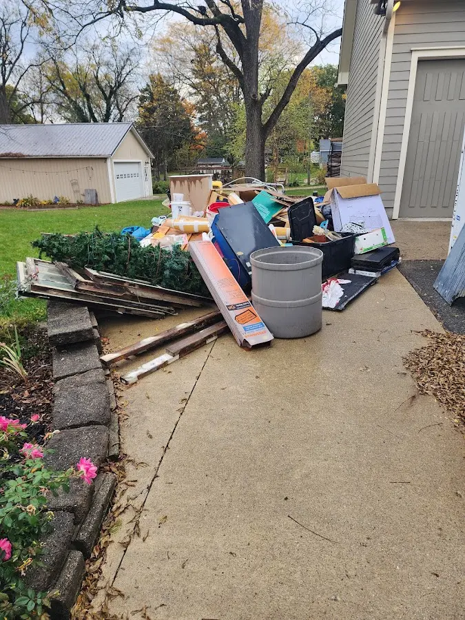 Dumpster being loaded with debris for Estate Cleanout Dumpster Rental in West Hempfield